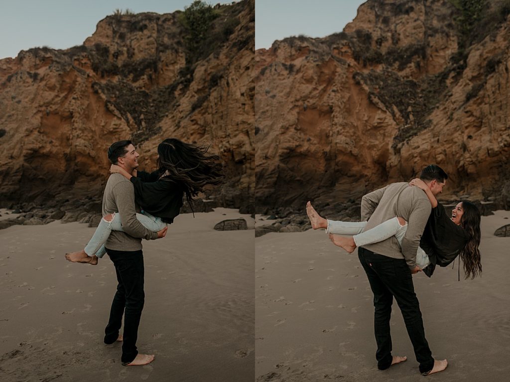 man holding girl on beach