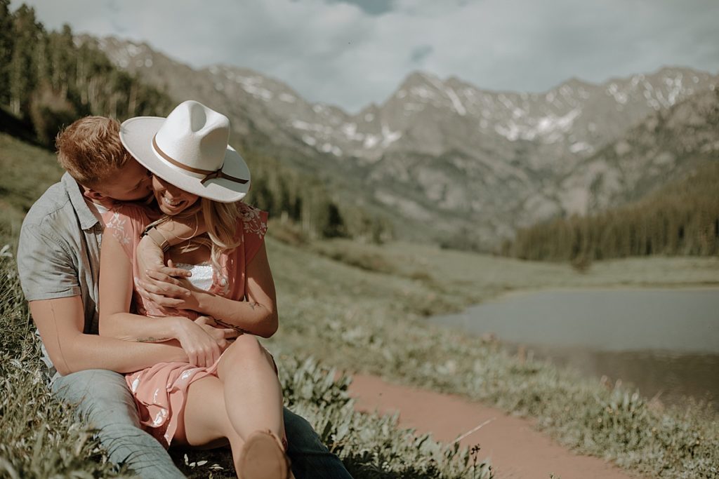 couple kissing on colorado mountains at piney river ranch