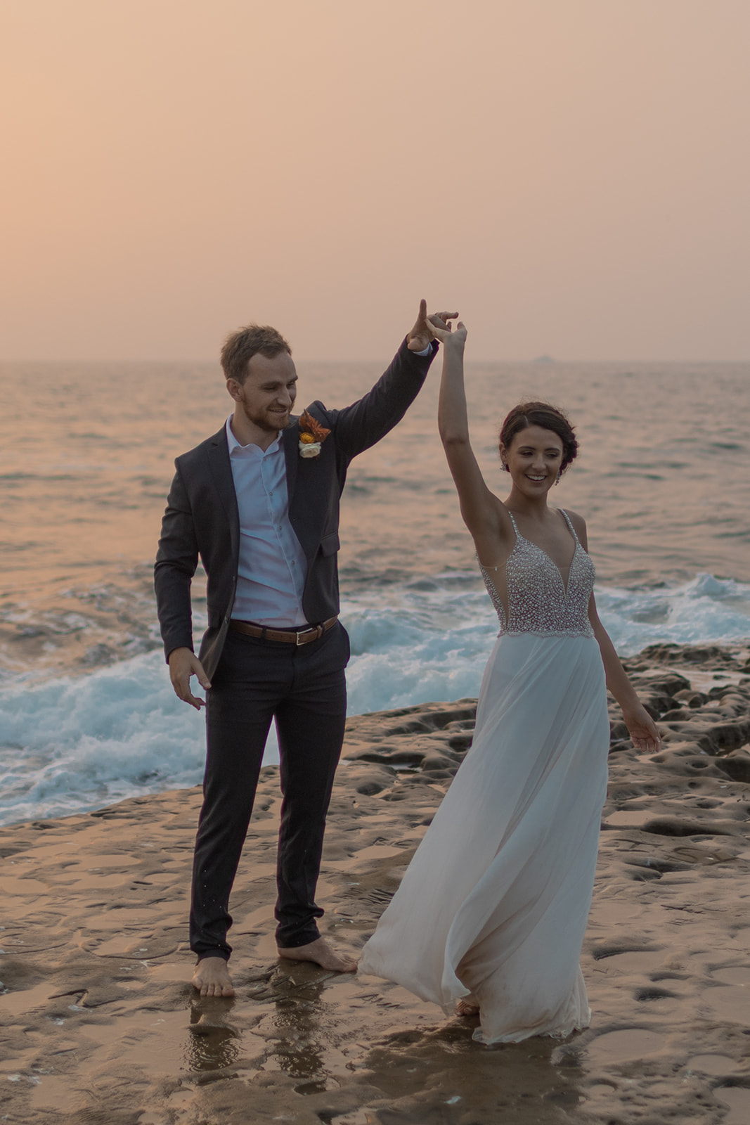 San Diego Elopement at Sunset Cliffs with bride and groom dancing at sunset