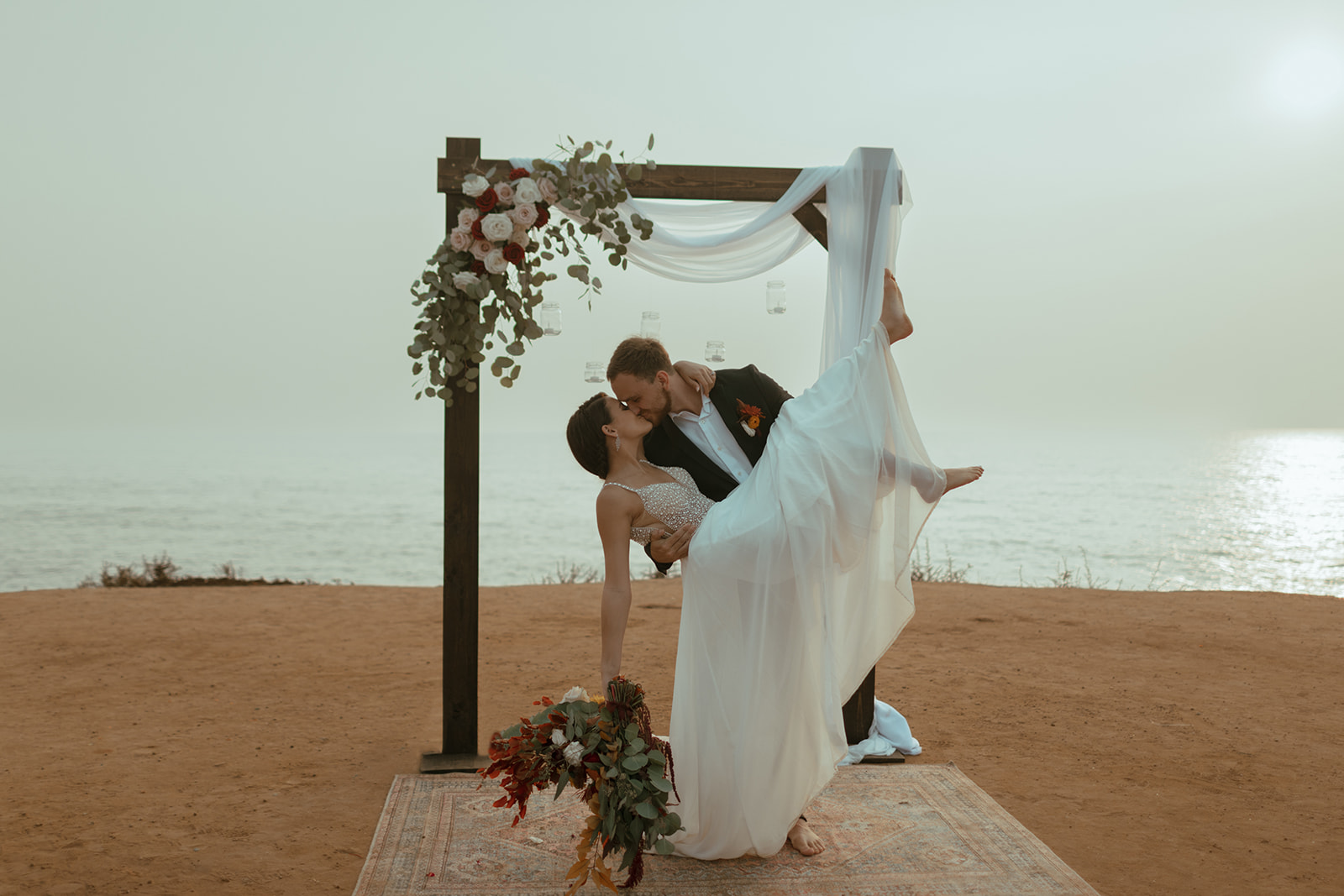 San Diego Elopement at Sunset Cliffs with bride and groom celebrating at their ceremony