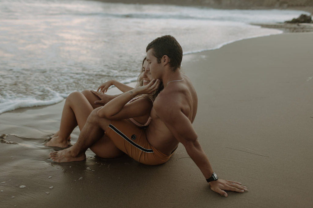 couple hugging on beach
