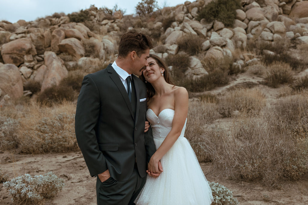couple hugging at desert elopement during styled photo shoots